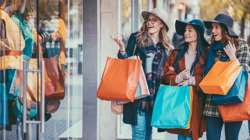 Friends enjoying the savings during shopping spree